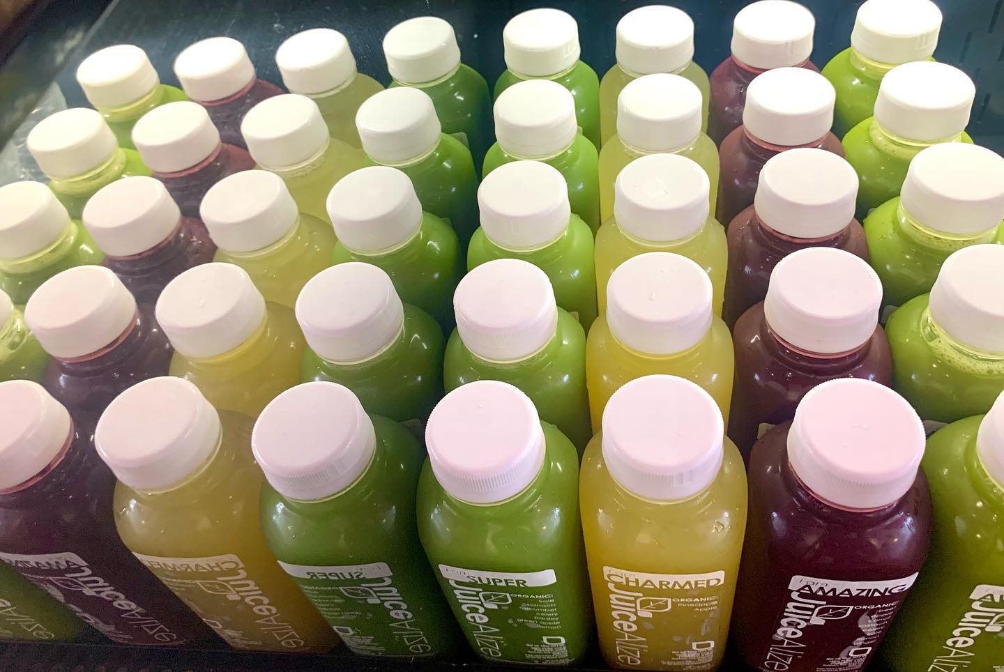 Cases of fresh JuiceAlize bottles ready for wholesale delivery